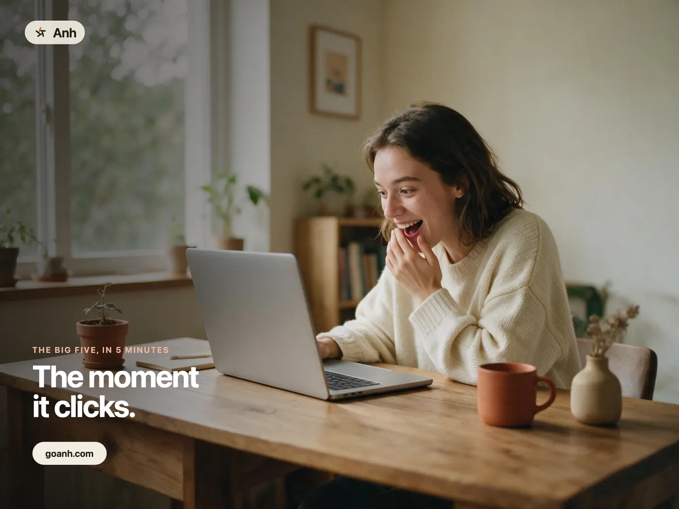 A person at a kitchen table reacting to their Anh results on a laptop