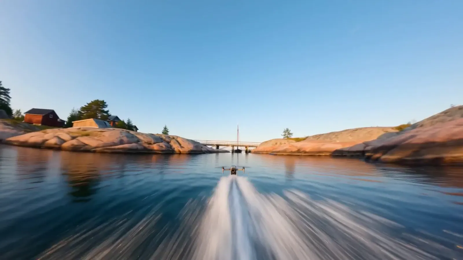 Water-level travel toward a cabin. Swedish summer, no crew, no boat.